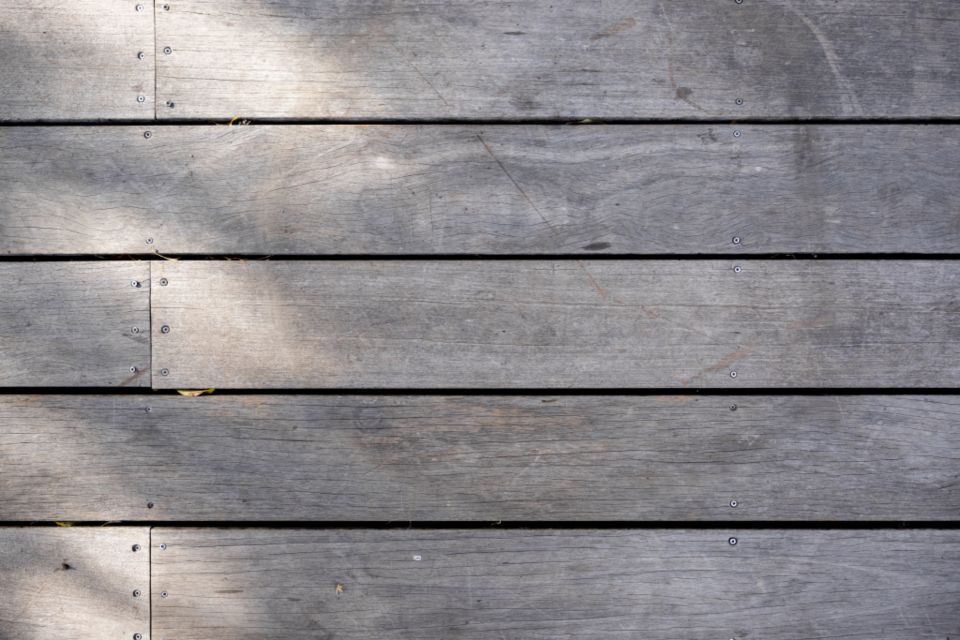 Gray, weathered deck boards that need cleaning